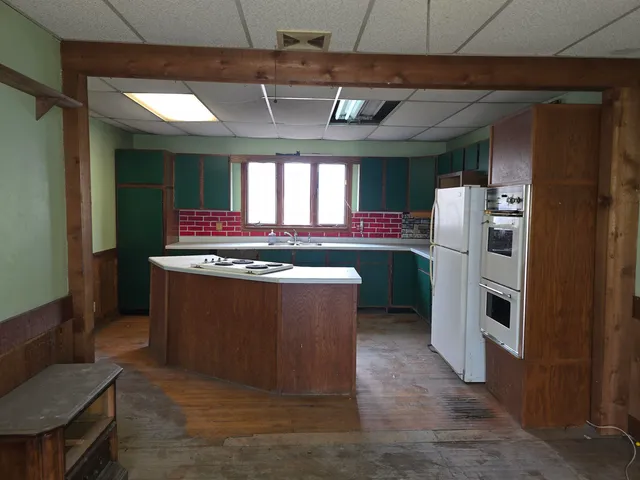 a room with table chairs and entryway
