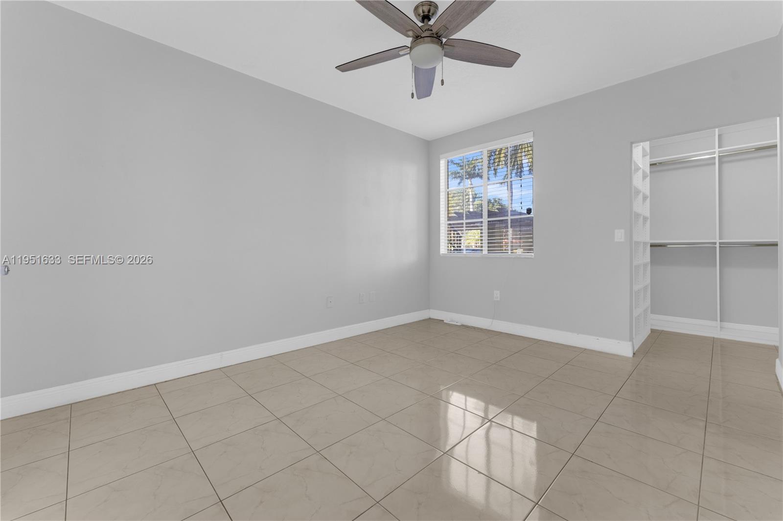 2400 East Preserve Way, Unit 101 Miramar, FL 33025 - Photo 16 of 41 a view of an empty room with a window