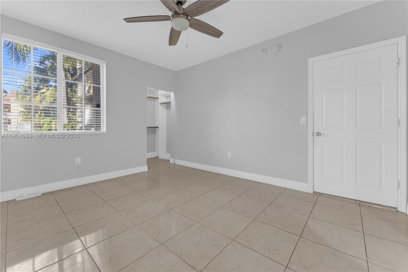 2400 East Preserve Way, Unit 101 Miramar, FL 33025 - Photo 17 of 41 a view of an empty room with a window
