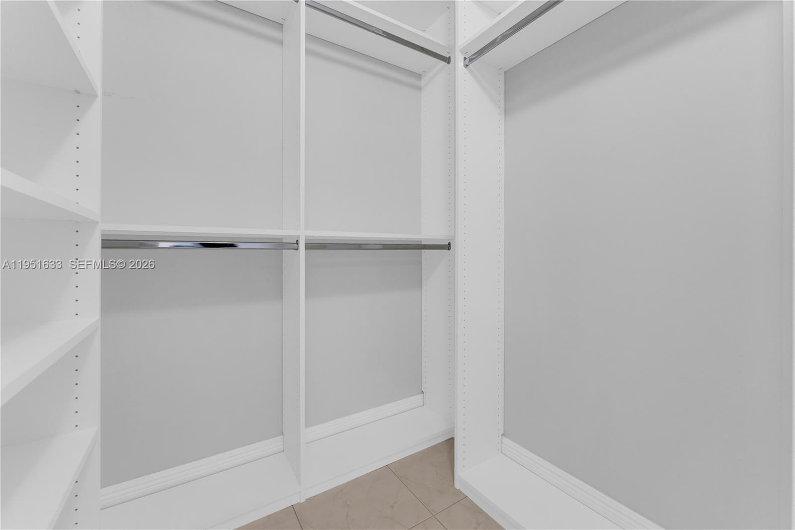 2400 East Preserve Way, Unit 101 Miramar, FL 33025 - Photo 18 of 41 a bathroom with a glass shower door