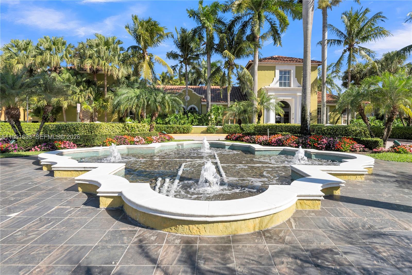 2400 East Preserve Way, Unit 101 Miramar, FL 33025 - Photo 35 of 41 a view of a swimming pool with a patio