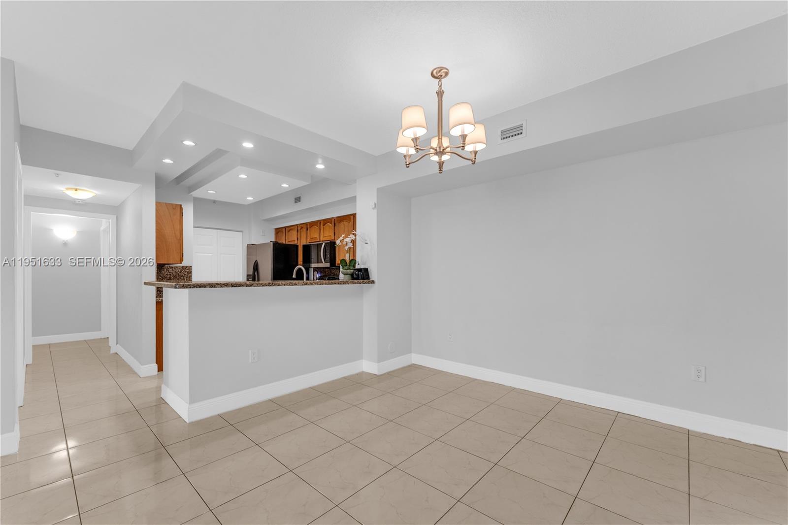 2400 East Preserve Way, Unit 101 Miramar, FL 33025 - Photo 4 of 41 a view of a kitchen with a sink and refrigerator