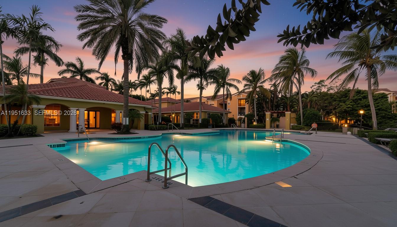 2400 East Preserve Way, Unit 101 Miramar, FL 33025 - Photo 41 of 41 a swimming pool with outdoor seating yard and palm tree