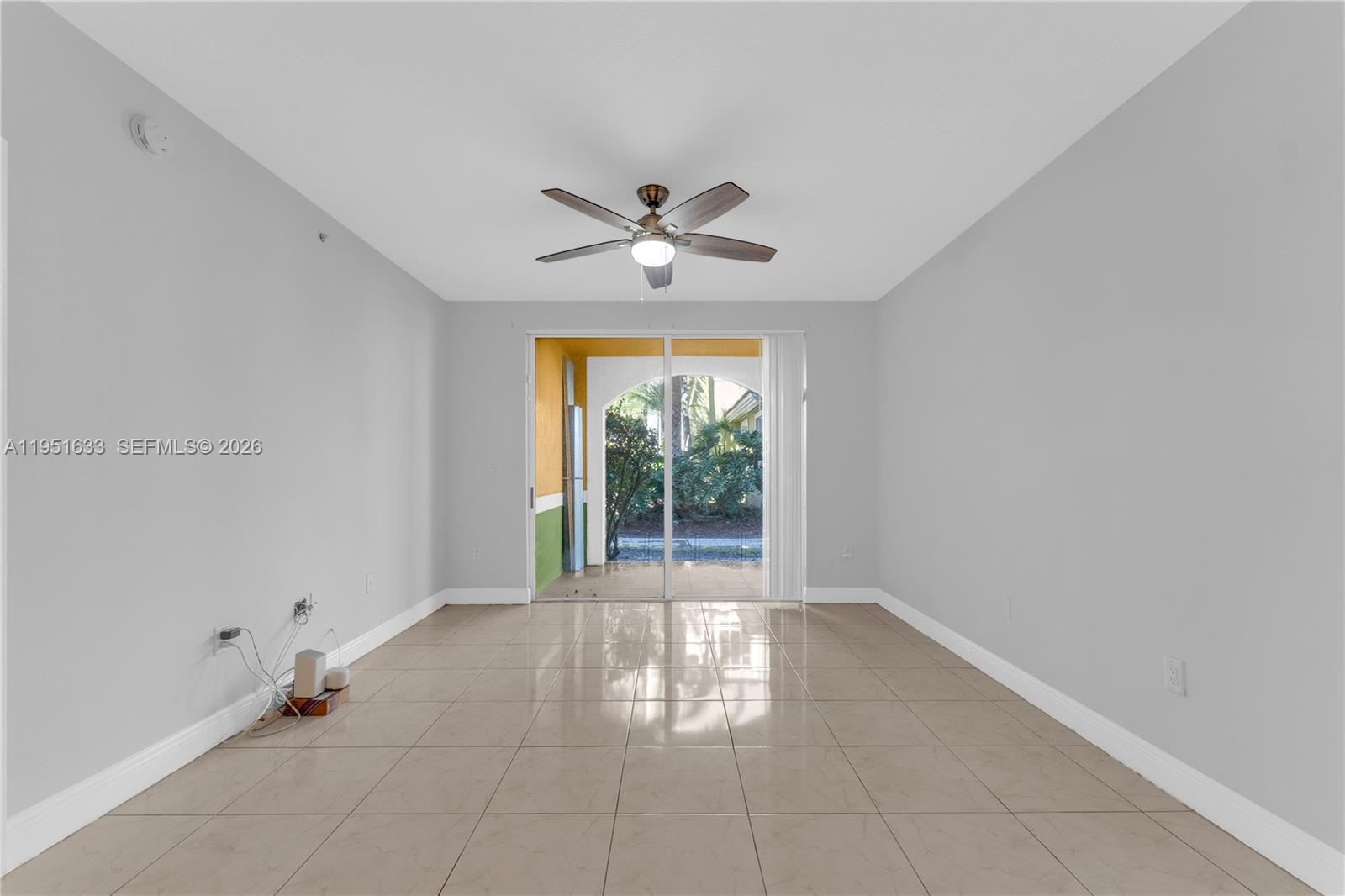 2400 East Preserve Way, Unit 101 Miramar, FL 33025 - Photo 6 of 41 a view of an empty room with a window