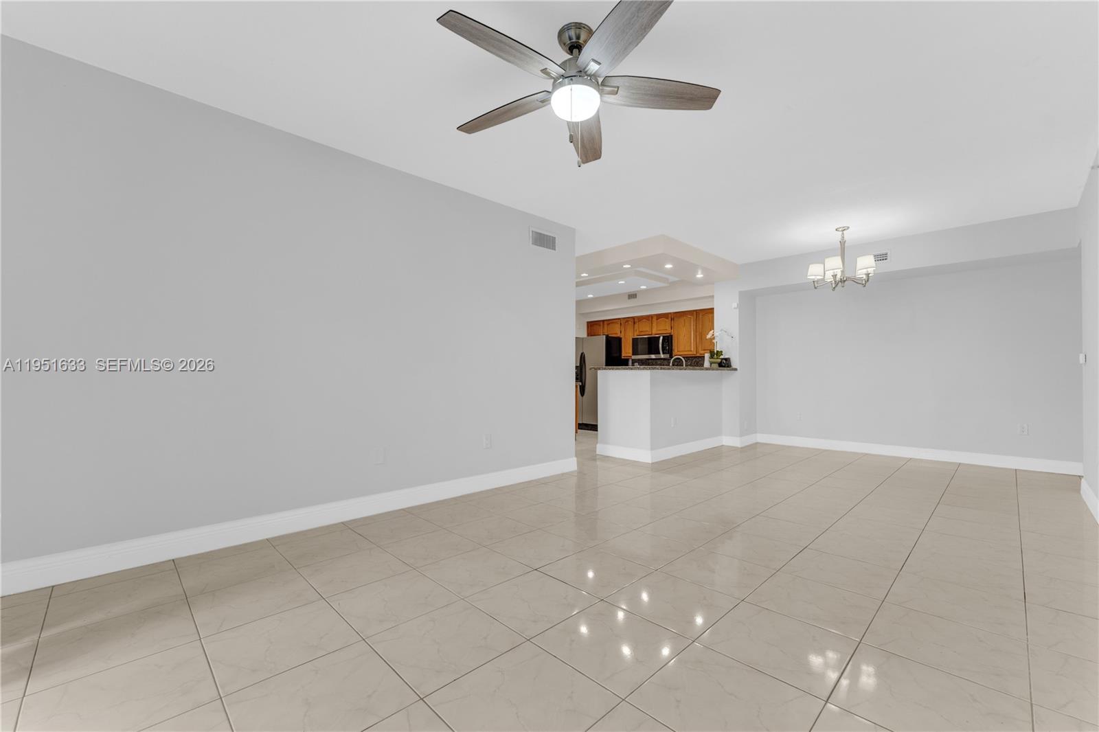 2400 East Preserve Way, Unit 101 Miramar, FL 33025 - Photo 7 of 41 wooden floor in an empty room with a window
