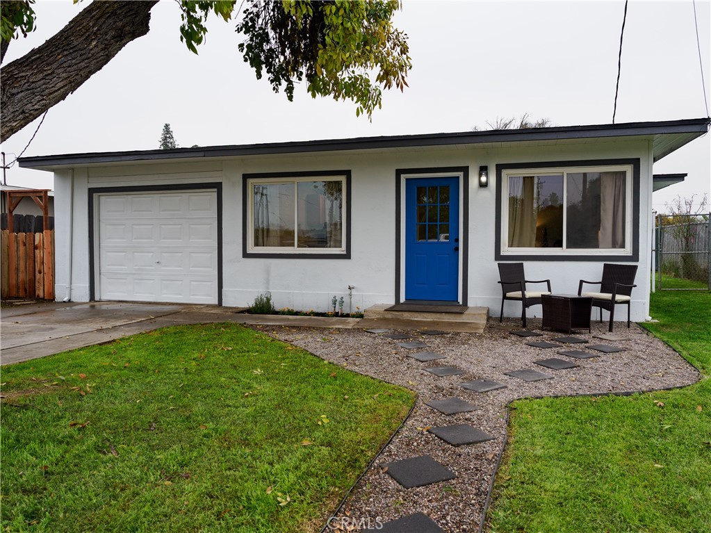 a view of house with backyard