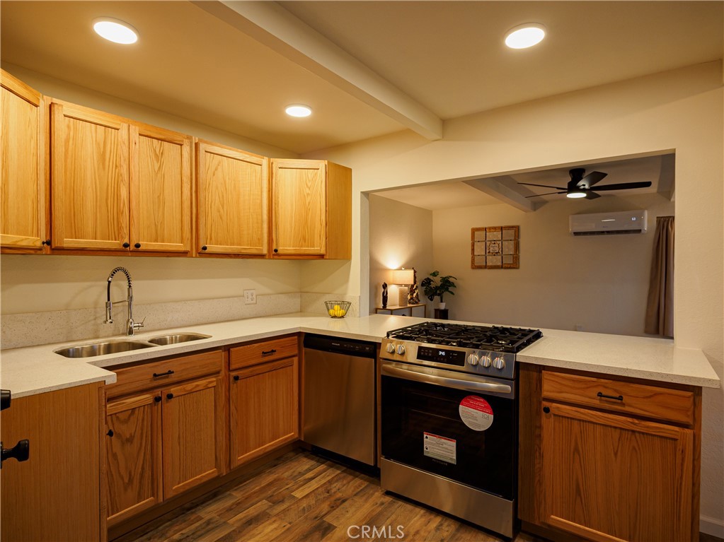 1745 Dale Avenue Merced, CA 95340 - Photo 4 of 18 a kitchen with a sink stove and cabinets