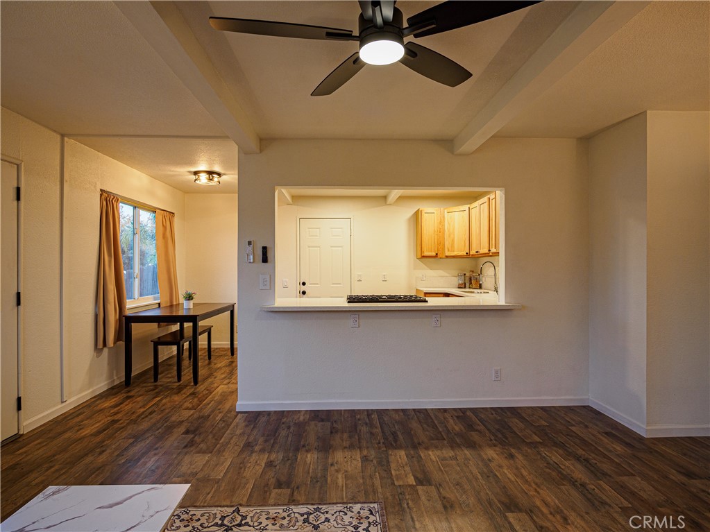 1745 Dale Avenue Merced, CA 95340 - Photo 7 of 18 a view of a room with wooden floor a ceiling fan and windows