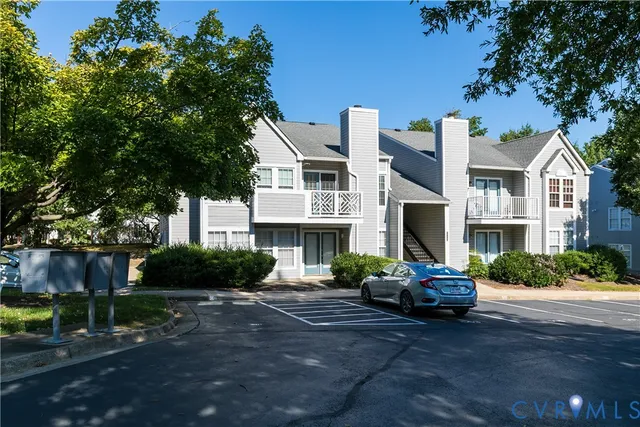 a front view of a house with a yard and a garage