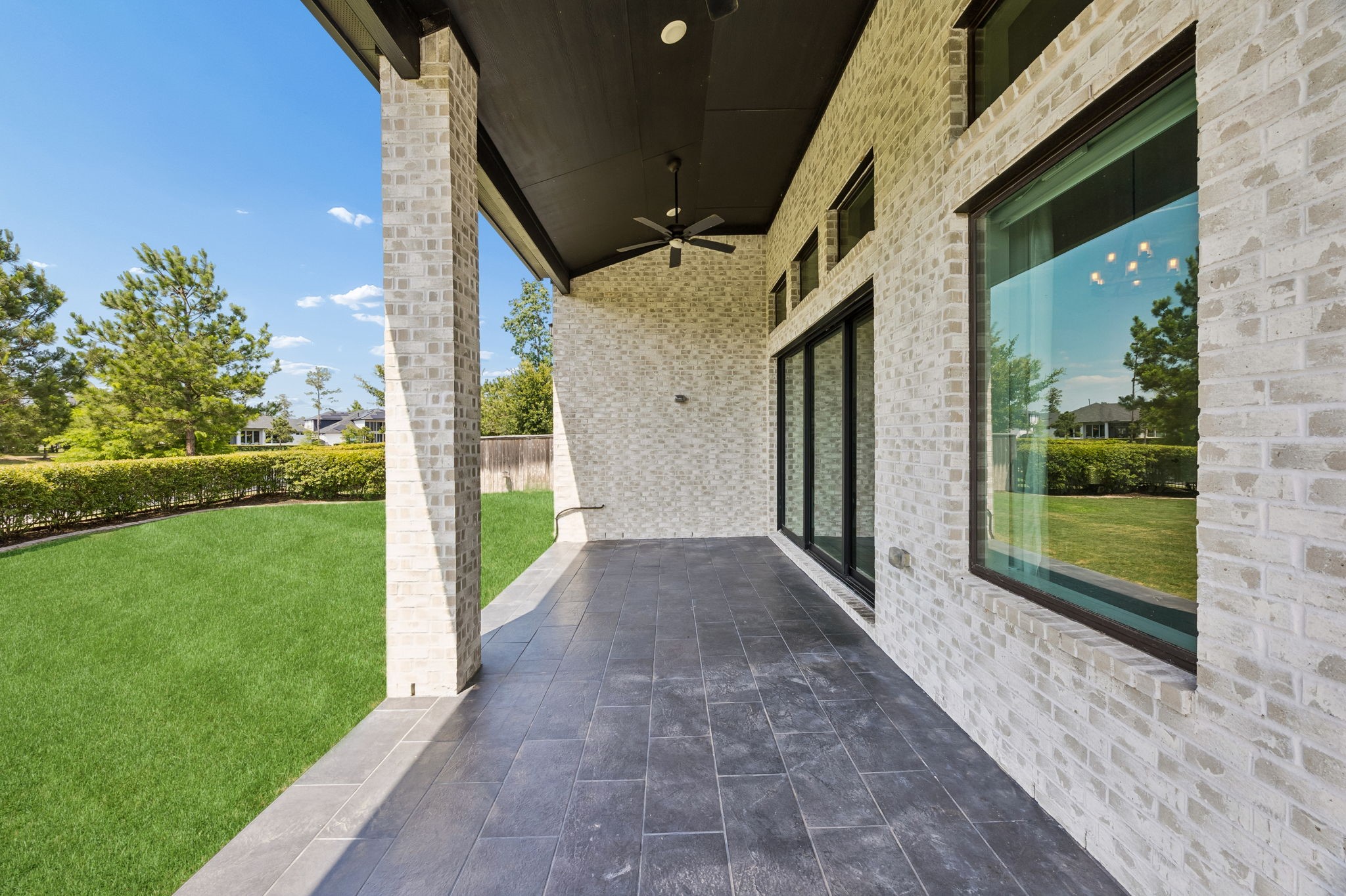10102 South Goshawk Trail Conroe, TX 77385 - Photo 37 of 46 a view of a porch with a yard