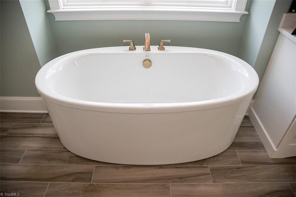 6900 Matzinger Court Oak Ridge, NC 27310 - Photo 17 of 30 Sunstruck Oval Freestanding bath w/Straight Apron.
