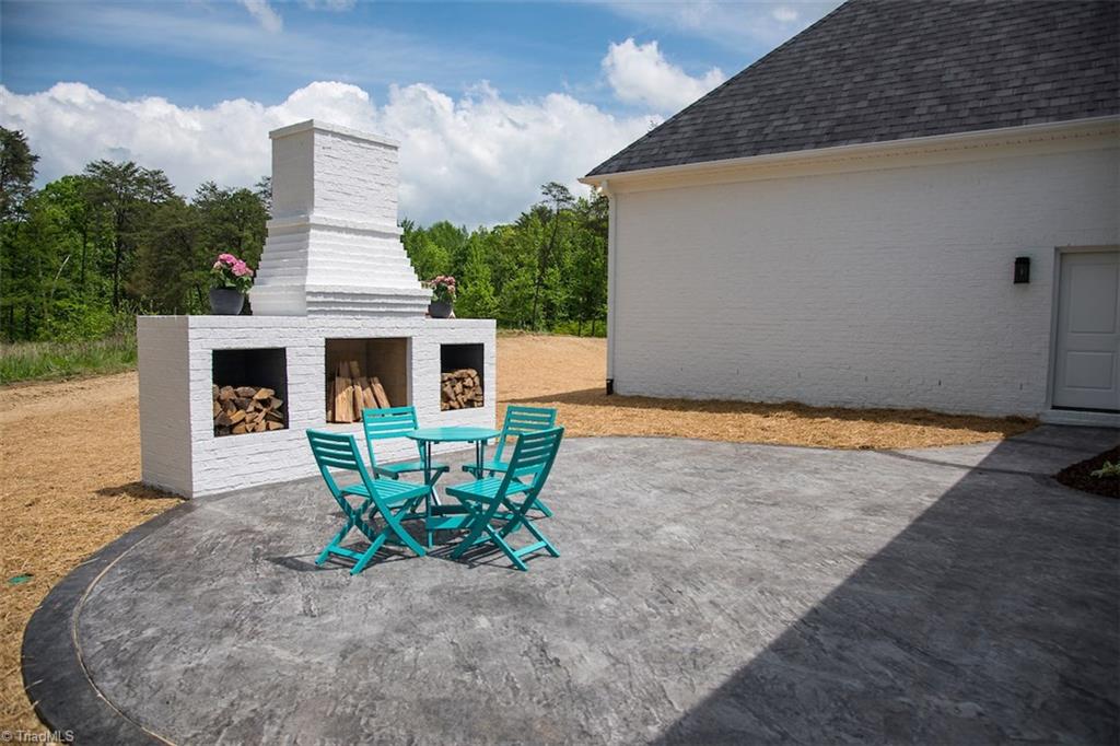 6900 Matzinger Court Oak Ridge, NC 27310 - Photo 26 of 30 Patio and outdoor fireplace.
