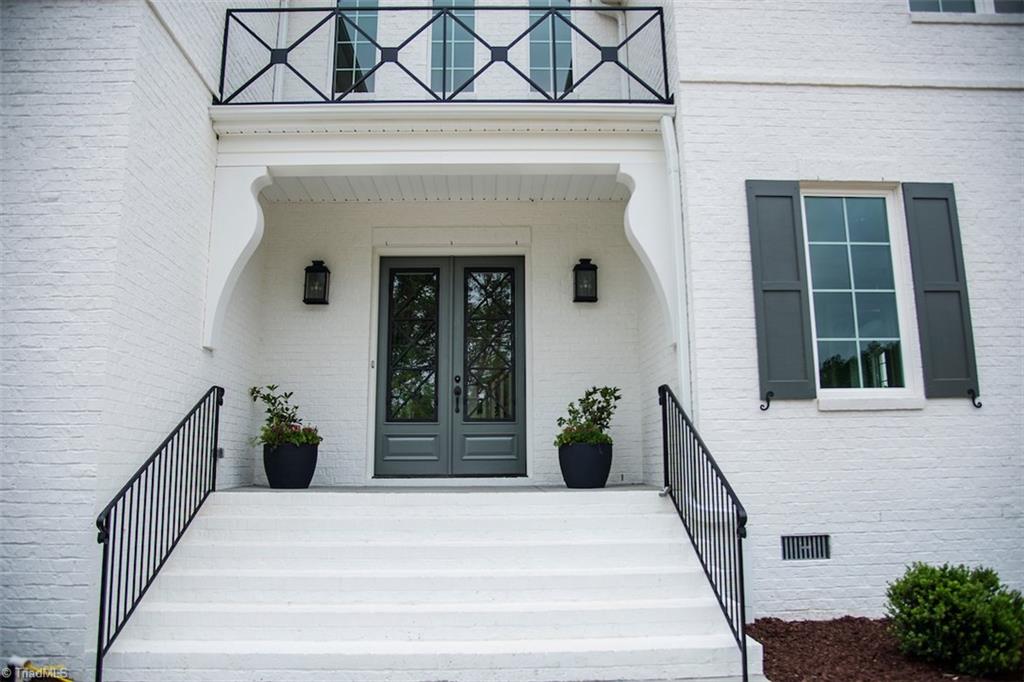 6900 Matzinger Court Oak Ridge, NC 27310 - Photo 29 of 30 Entry showcasing detailed iron work above front doors.