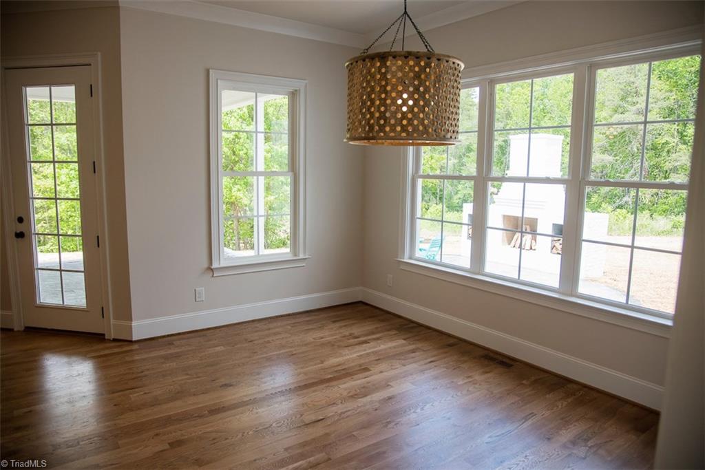 6900 Matzinger Court Oak Ridge, NC 27310 - Photo 9 of 30 Eat-in kitchen area with view to patio.