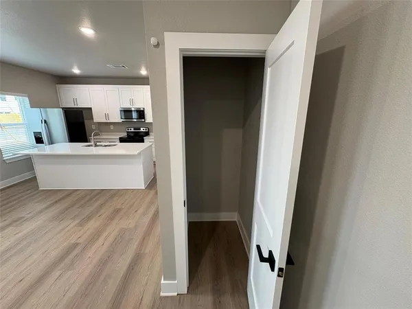 a view of kitchen with stainless steel appliances kitchen island