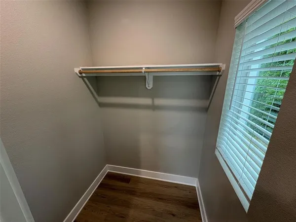 a bathroom with a sink a toilet a mirror and shower