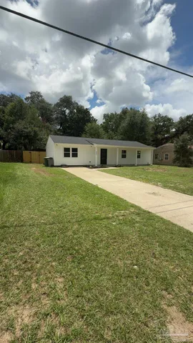 a view of a swimming pool with a yard