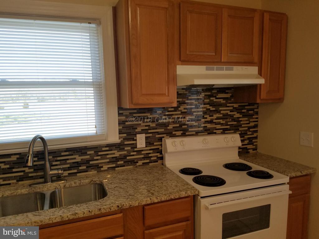 28234 Stanford Road Eden, MD 21822 - Photo 13 of 35 a kitchen with a sink and cabinets