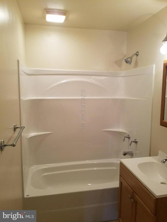 28234 Stanford Road Eden, MD 21822 - Photo 22 of 35 a bathroom with a bathtub and a sink