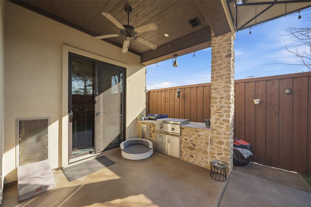 3105 Pastor Street Dallas, TX 75212 - Photo 26 of 28 View of covered patio with ceiling fan and buit in exterior kitchen with a griddle.