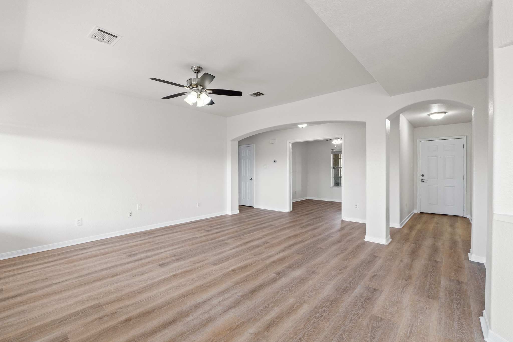 902 Terra Street Round Rock, TX 78665 - Photo 12 of 35 wooden floor in an empty room with a window