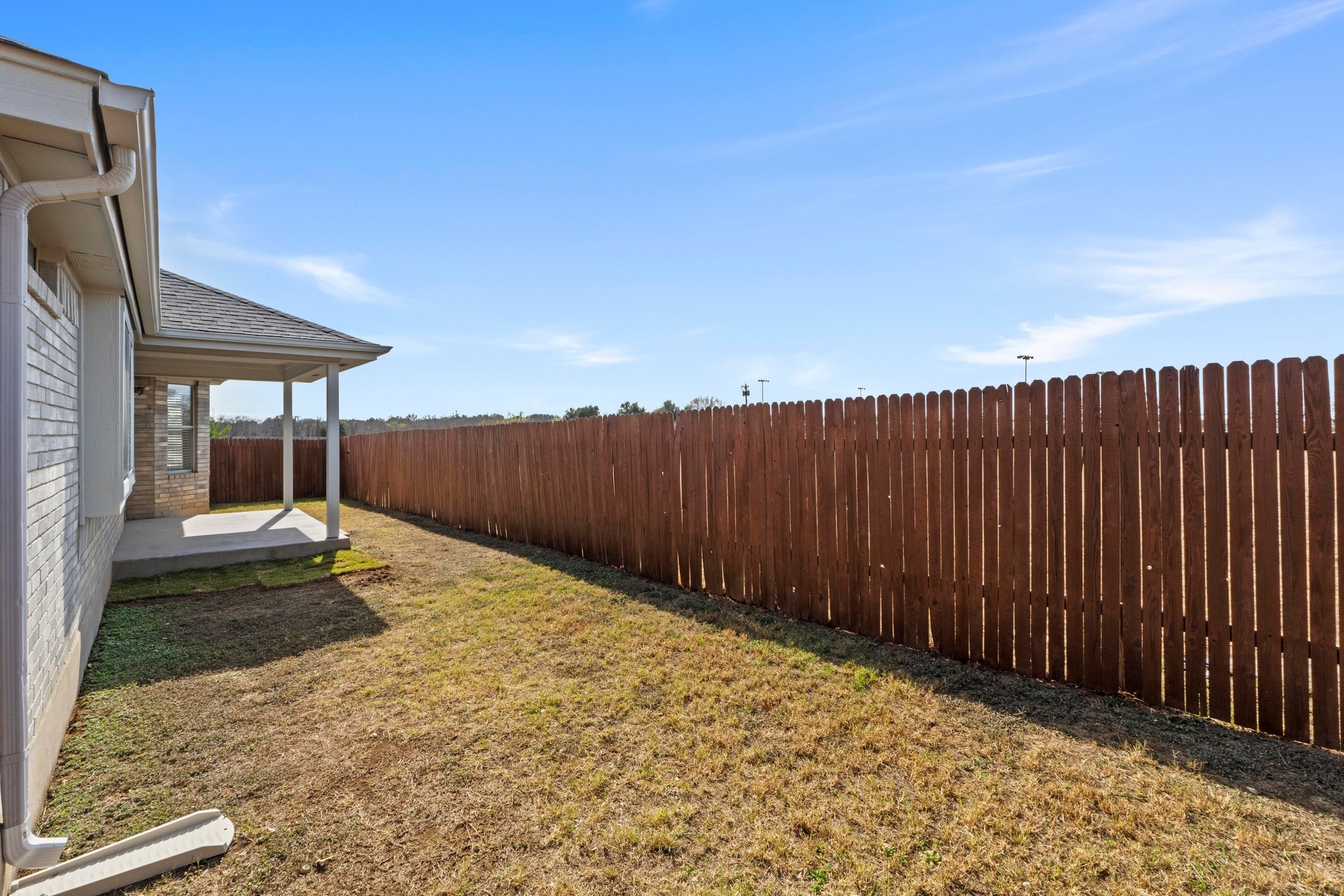 902 Terra Street Round Rock, TX 78665 - Photo 30 of 35 a backyard of a house with table and chairs