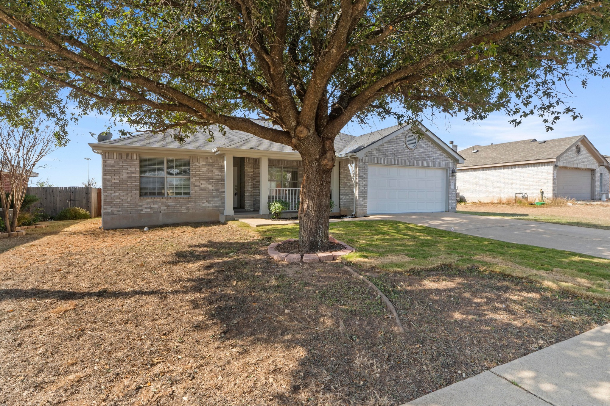 902 Terra Street Round Rock, TX 78665 - Photo 5 of 35 a front view of a house with a yard and garage