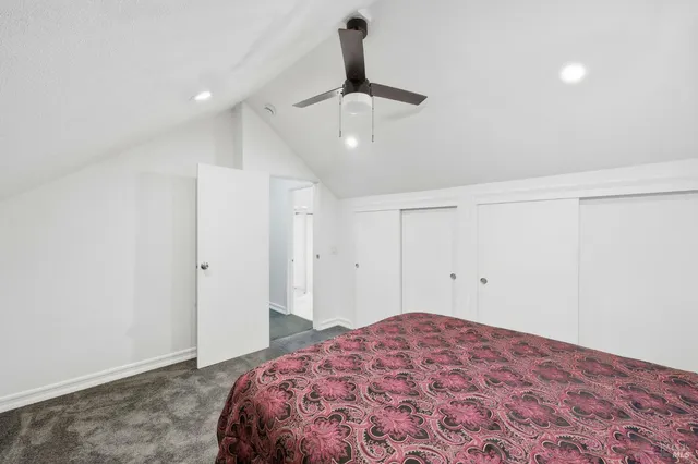 a bedroom with a bed and cabinets