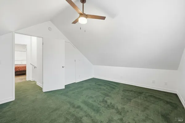a view of an empty room with closet
