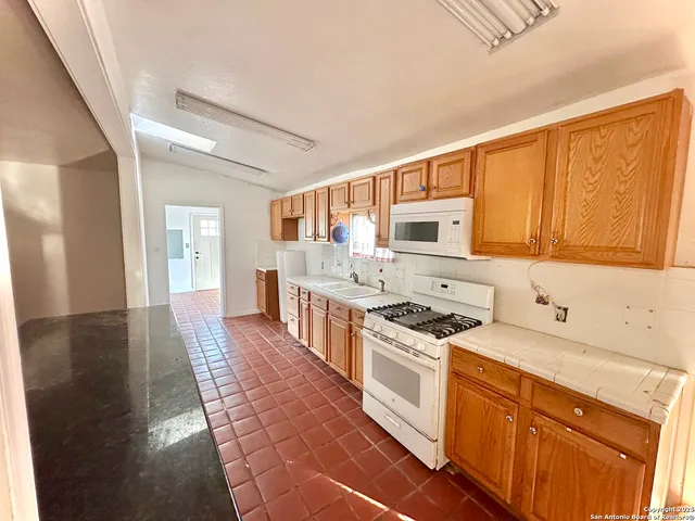 a view of kitchen with wooden floor
