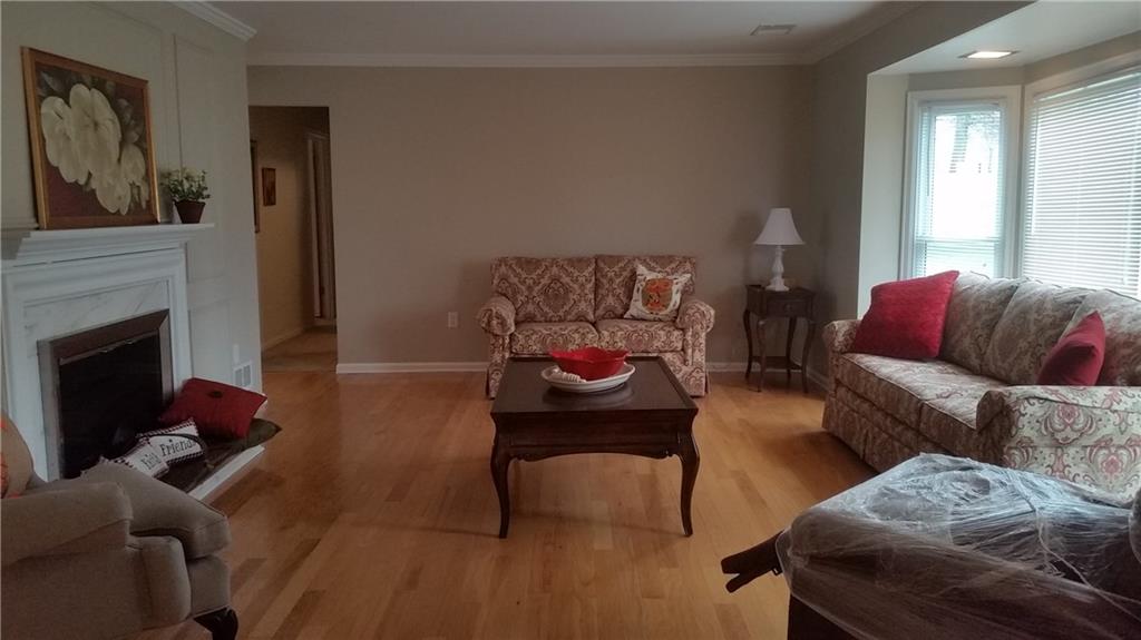 2321 Haymaker Road Monroeville, PA 15146 - Photo 8 of 25 Cozy Living Room with Wood burning Fireplace and Large Picture window with lighting! Abundance of Natural lighting!