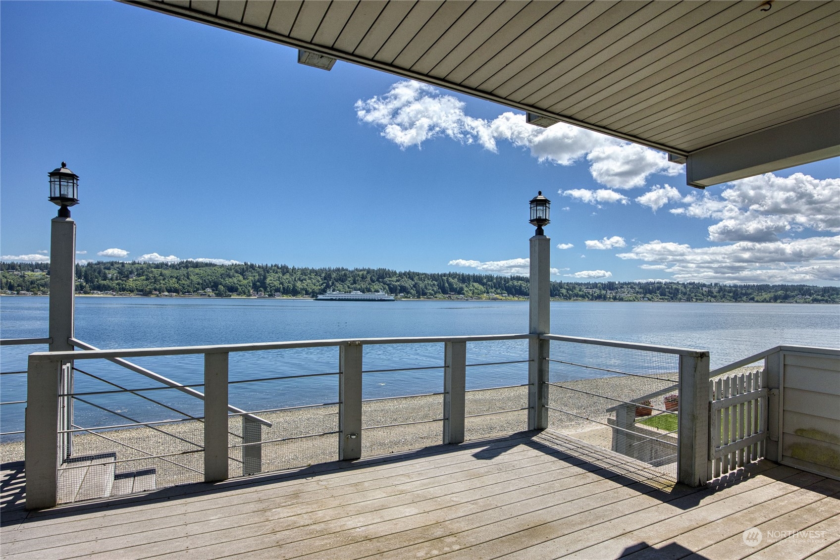 924 Shore Drive Bremerton, WA 98310 - Photo 11 of 36 a view of a balcony with wooden floor and iron stairs