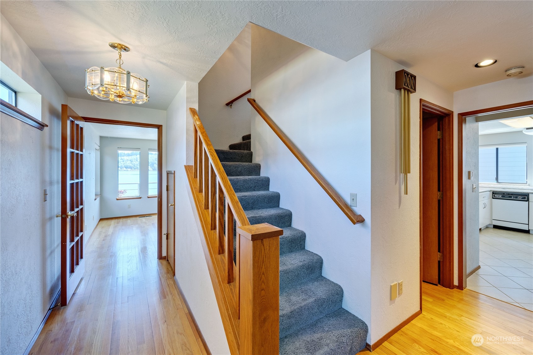924 Shore Drive Bremerton, WA 98310 - Photo 18 of 36 a view of a hallway with wooden floor and staircase