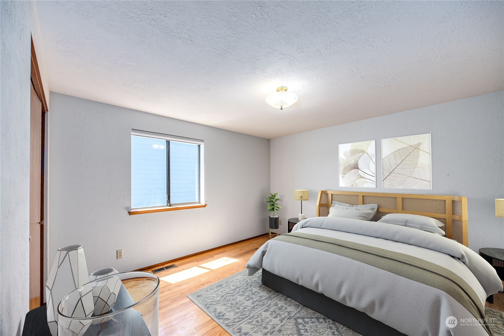 924 Shore Drive Bremerton, WA 98310 - Photo 25 of 36 a bedroom with a bed and wooden floor