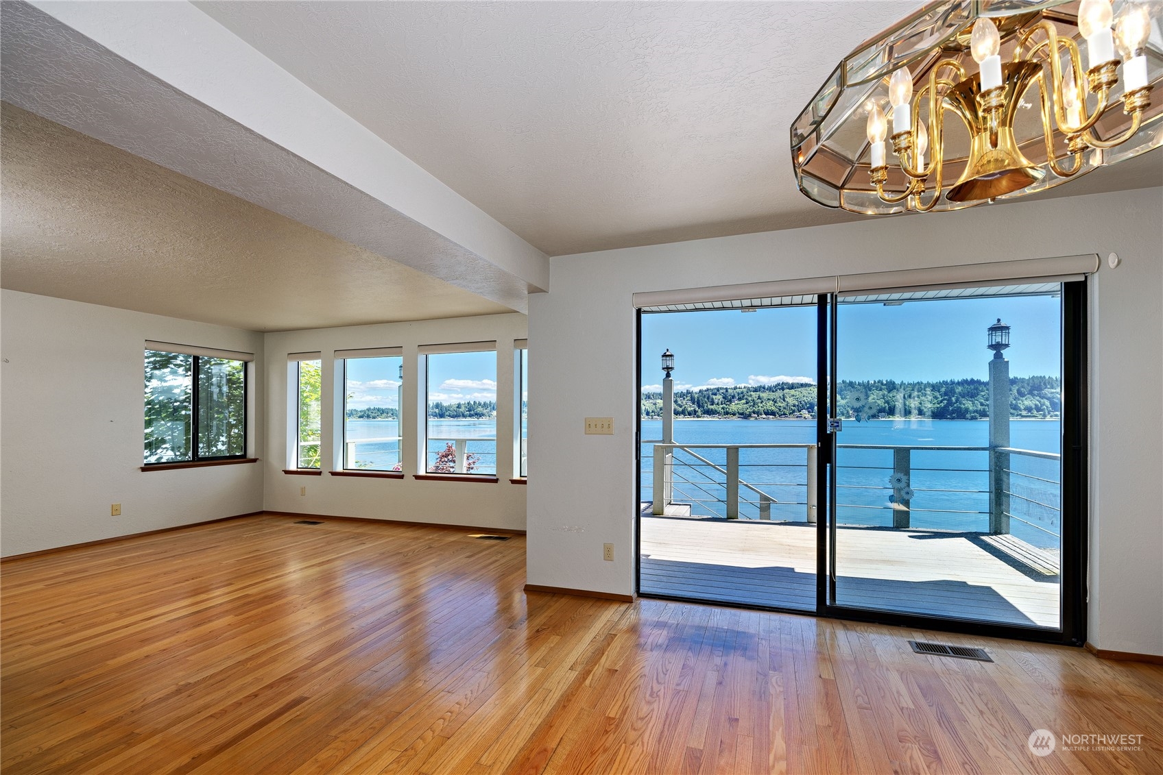 924 Shore Drive Bremerton, WA 98310 - Photo 9 of 36 a view of an empty room with wooden floor and a window