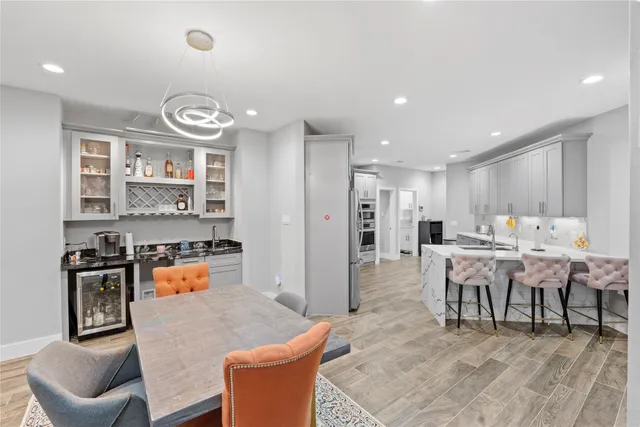 a large kitchen with a table and chairs