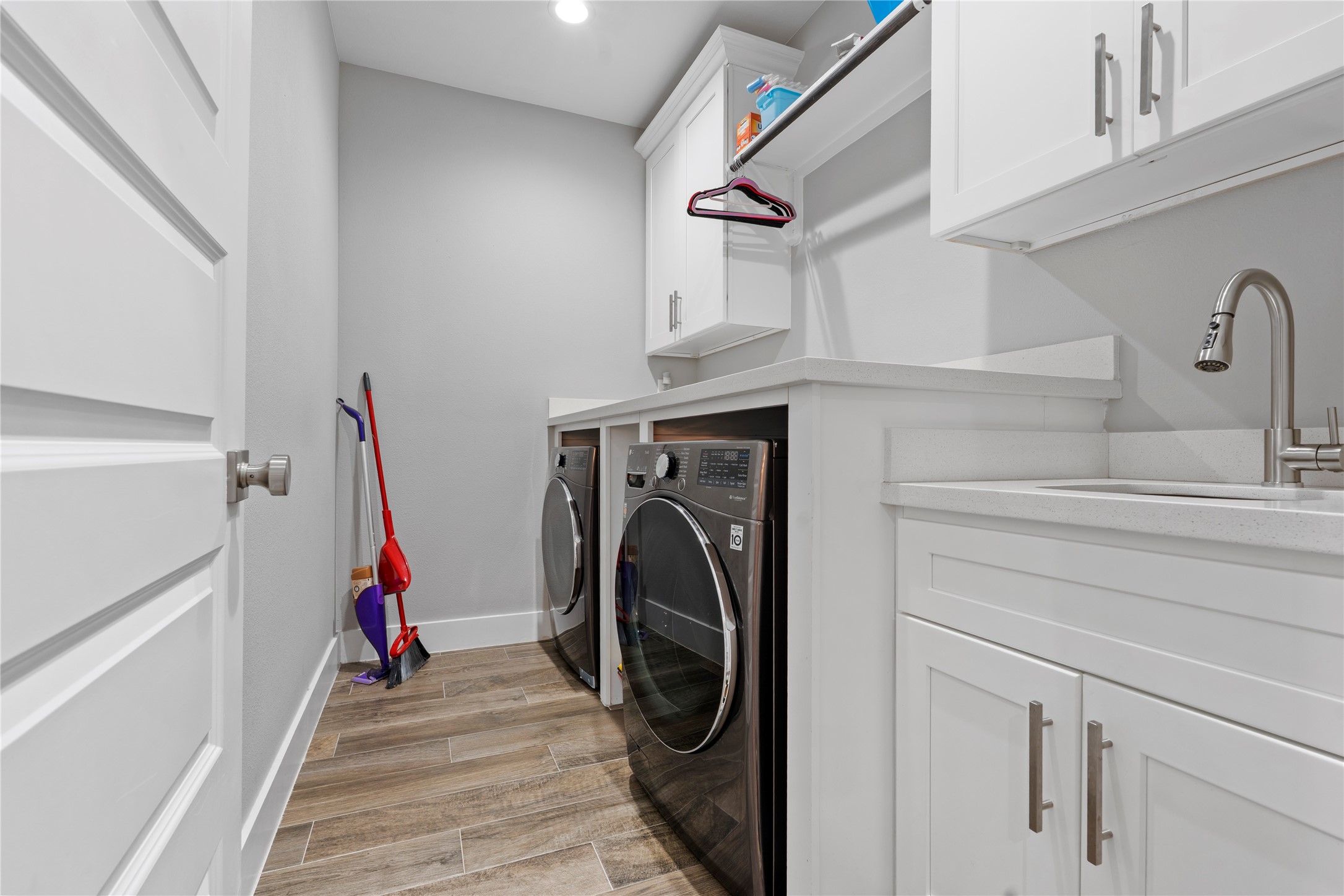 6207 Graff Net Court Spring, TX 77379 - Photo 21 of 49 Laundry day just got better! high-end washer and dryer, sink, and ample storage make chores a breeze.