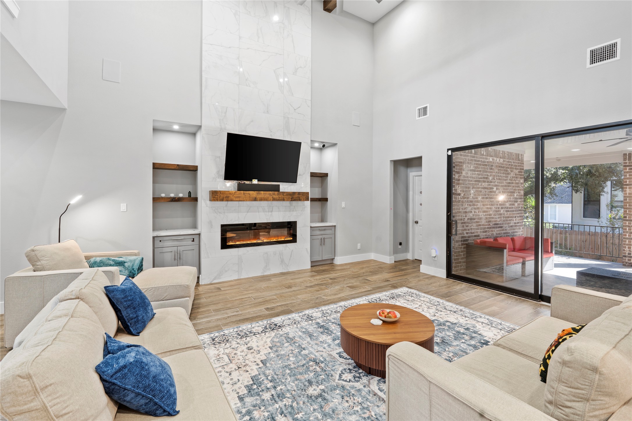 6207 Graff Net Court Spring, TX 77379 - Photo 42 of 49 Soak in the view of your lifted terrace from the living room’s stunning glass doors!