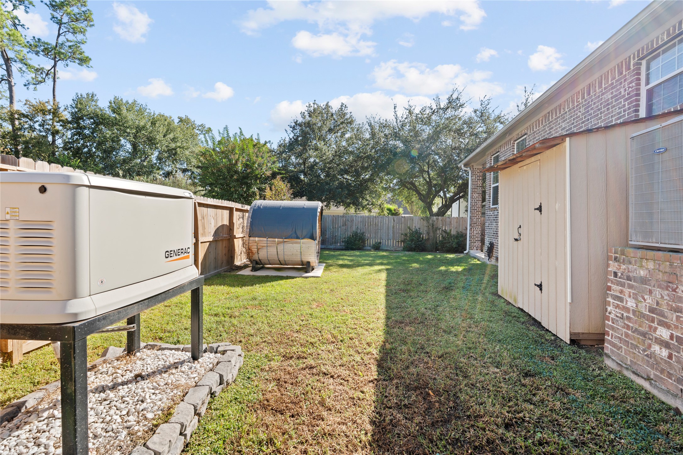 6207 Graff Net Court Spring, TX 77379 - Photo 46 of 49 Keep your tools safe and your lights on! Shed for storage, Generac for peace of mind.