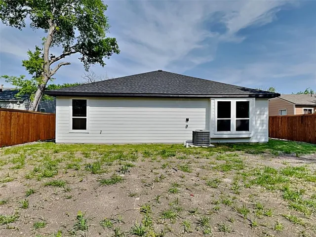 a house with a tree in front of it
