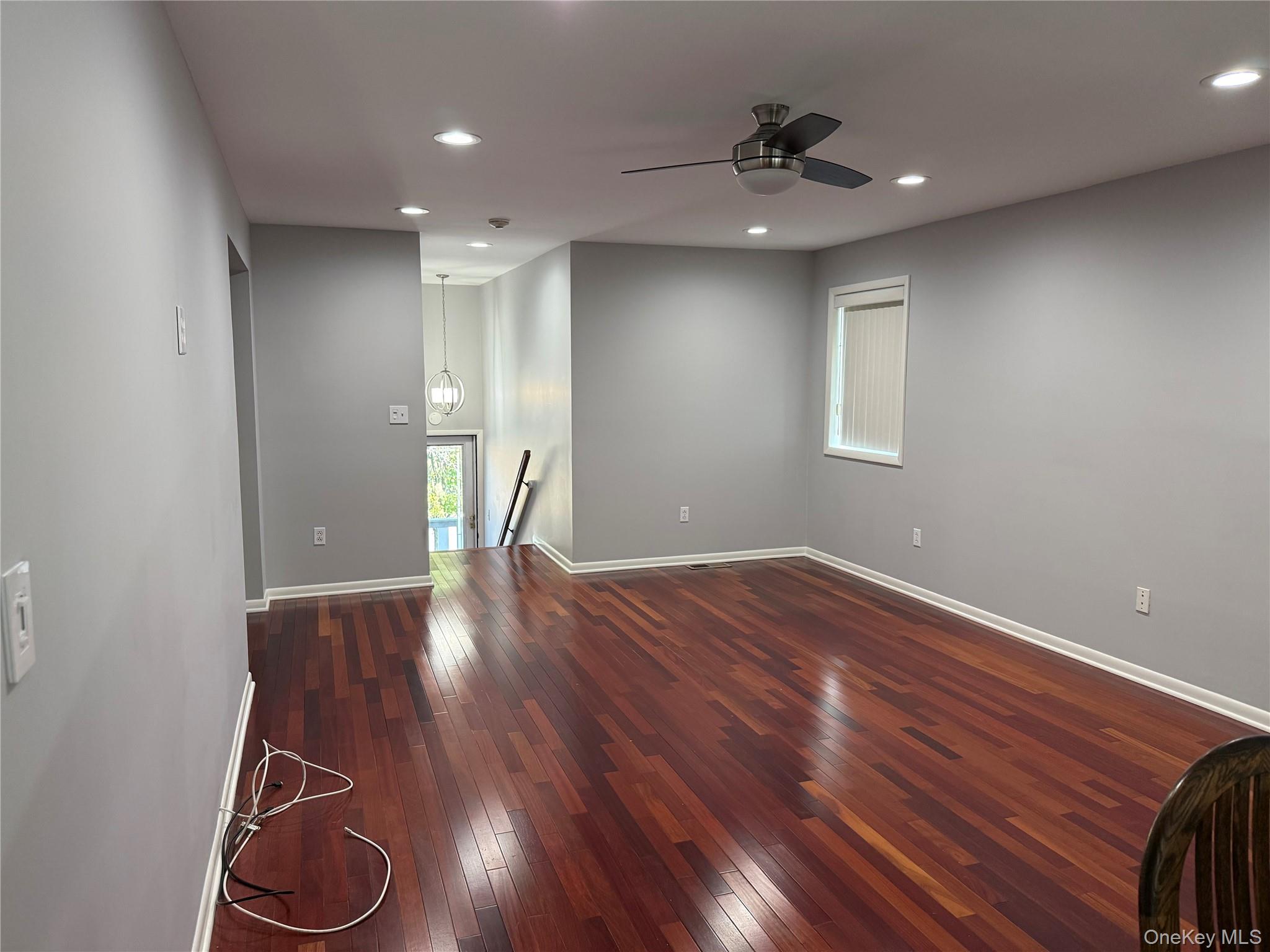 88 Eagle Ridge Way Nanuet, NY 10954 - Photo 7 of 16 a view of livingroom with hardwood floor and a ceiling fan