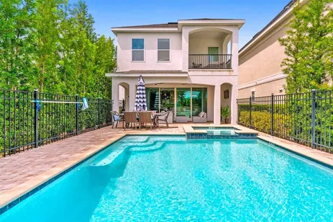 a swimming pool view with a outdoor seating space