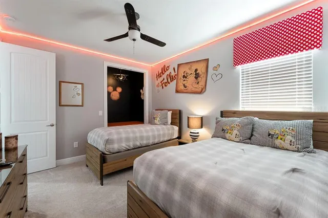 a bedroom with two beds and painted walls