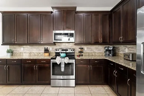 a kitchen with a sink and cabinets