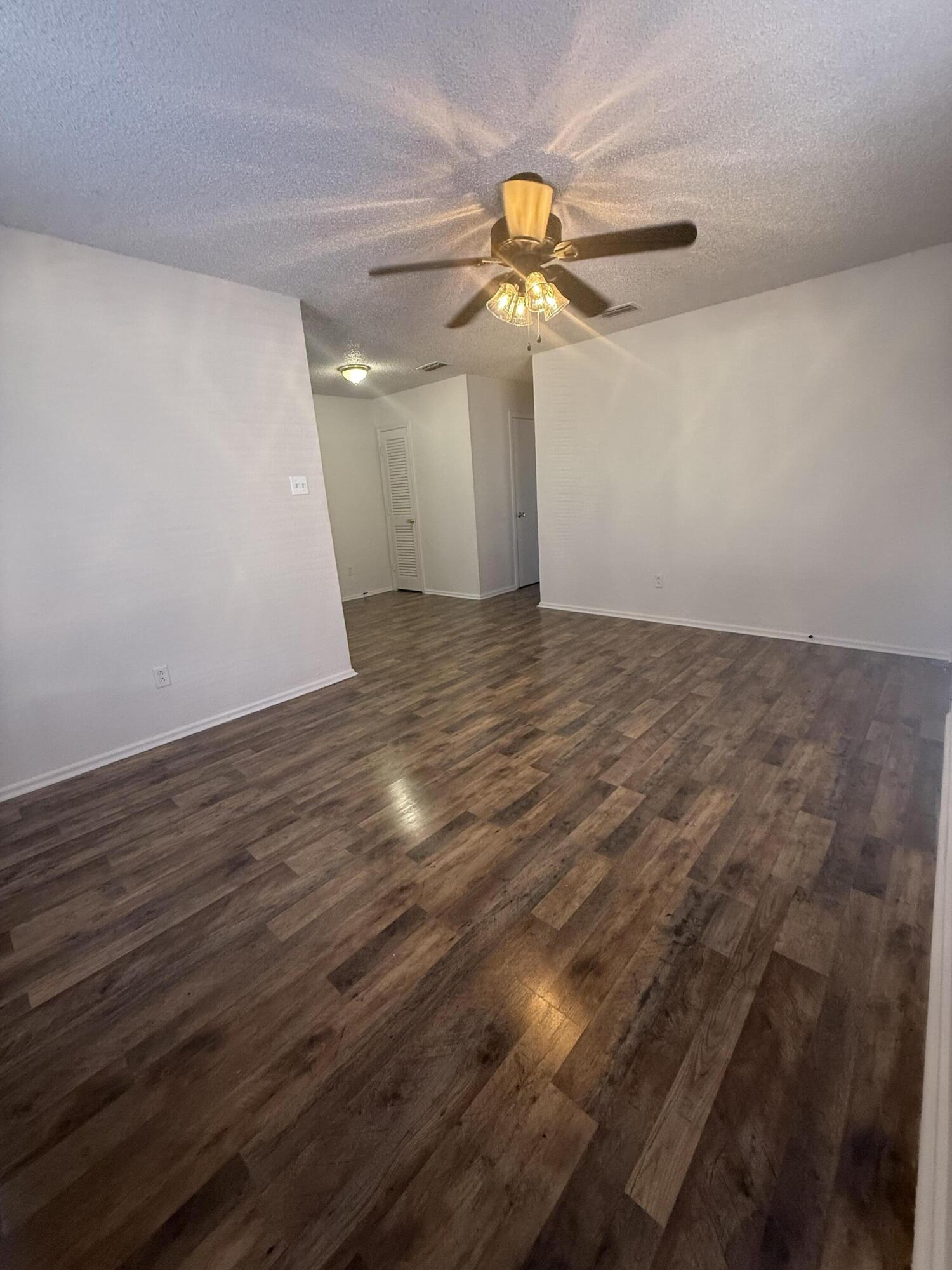 2317 15th Street Lubbock, TX 79401 - Photo 2 of 8 wooden floor in an empty room