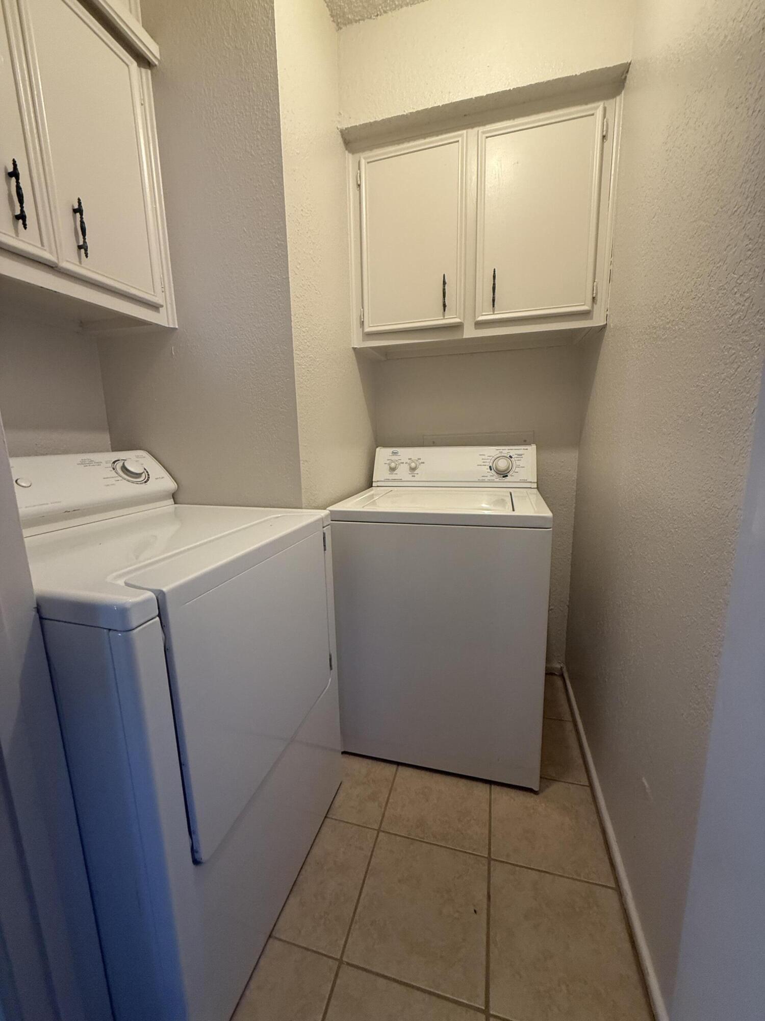 2317 15th Street Lubbock, TX 79401 - Photo 8 of 8 a utility room with dryer and washer