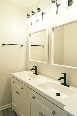 a bathroom with a sink and a mirror