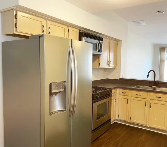 a white refrigerator freezer sitting inside of a kitchen