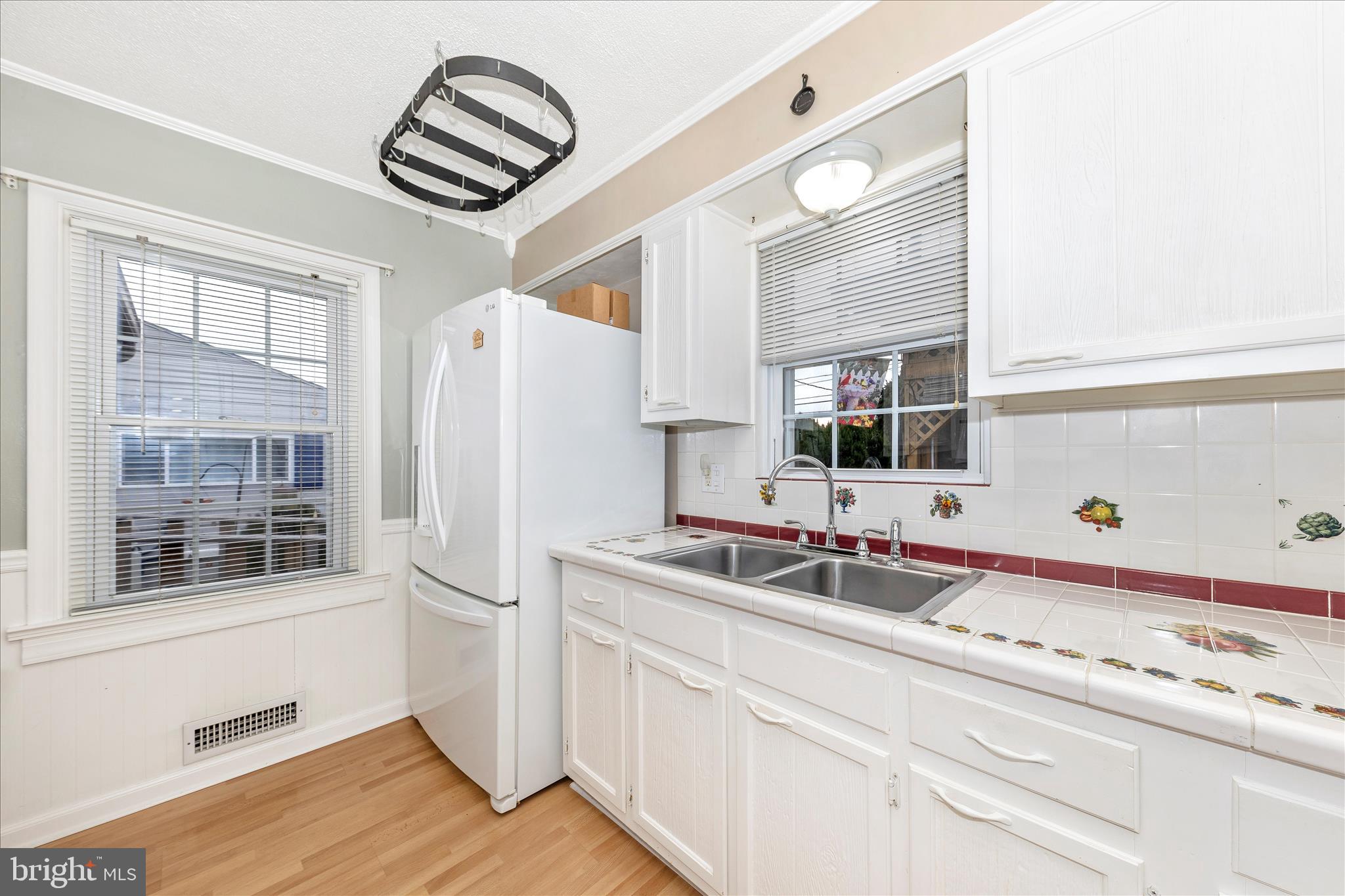 11304 Manse Road Hagerstown, MD 21740 - Photo 16 of 53 a kitchen with a sink and a refrigerator