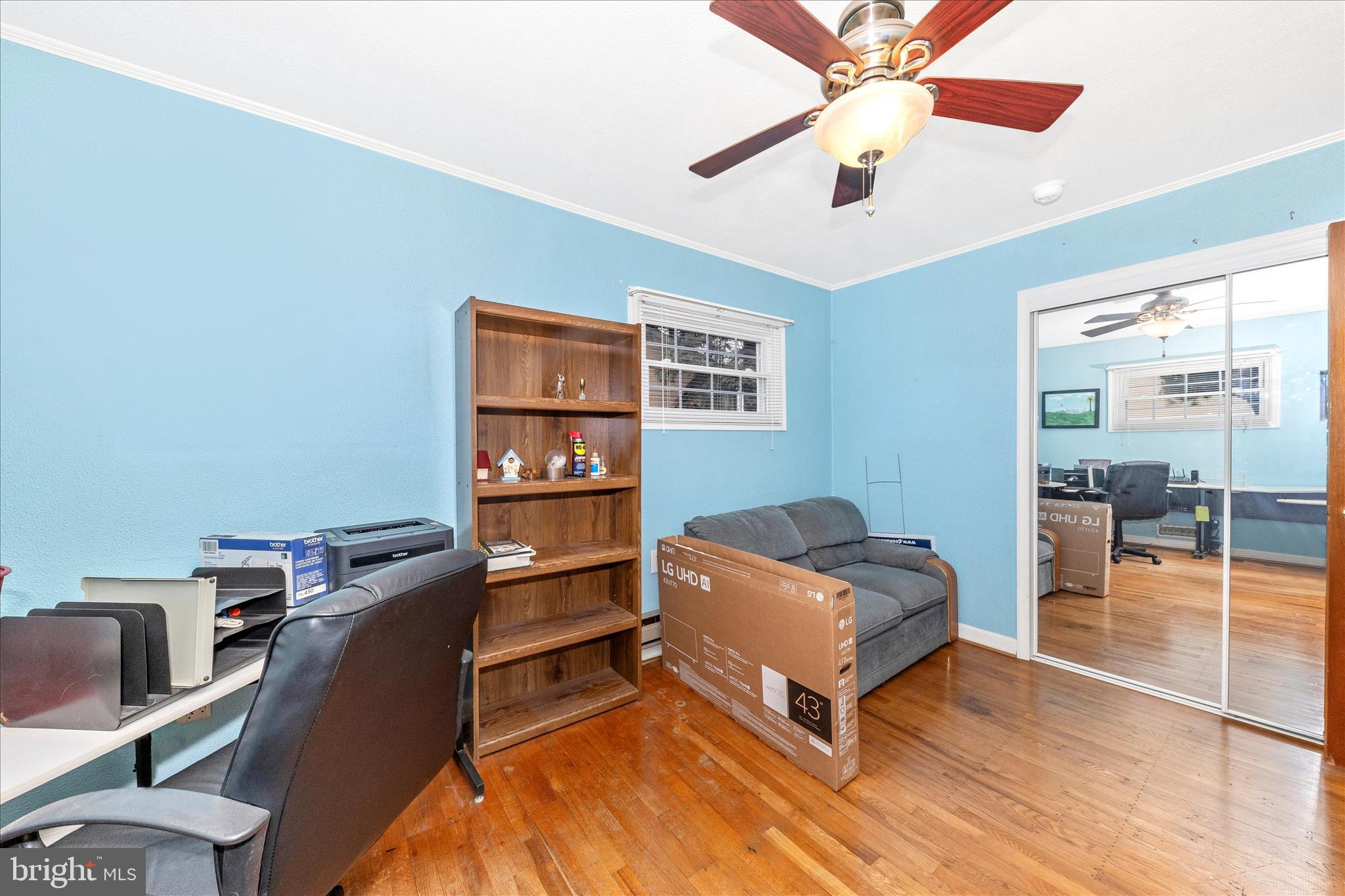 11304 Manse Road Hagerstown, MD 21740 - Photo 27 of 53 a living room with furniture and a bookshelf